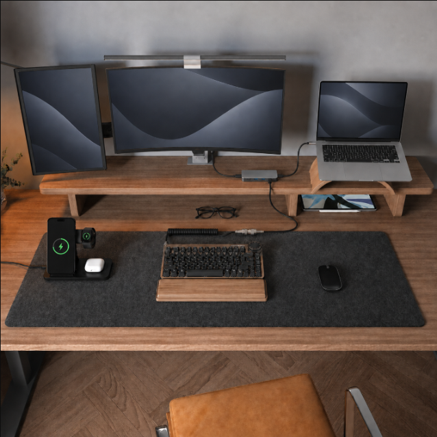 Home office desk setup with dual monitors, wireless charging stand, and USB-C hub
